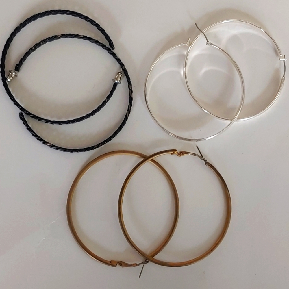 Hoop earring Trio. One bronze one black with rope detail and one silver